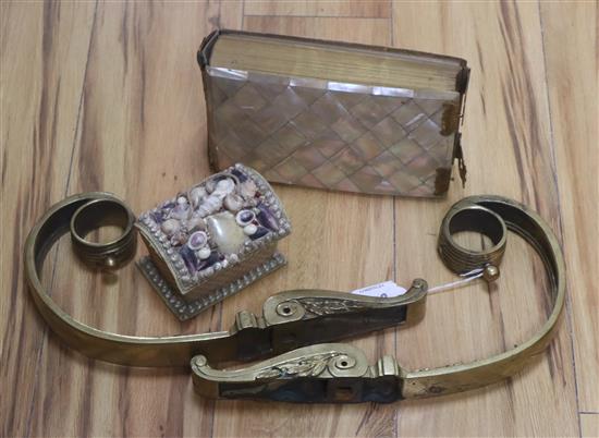 A pair of Empire style gilt metal curtain pole brackets, length 35cm and a Victorian mother of pearl photograph album and a leather mou
